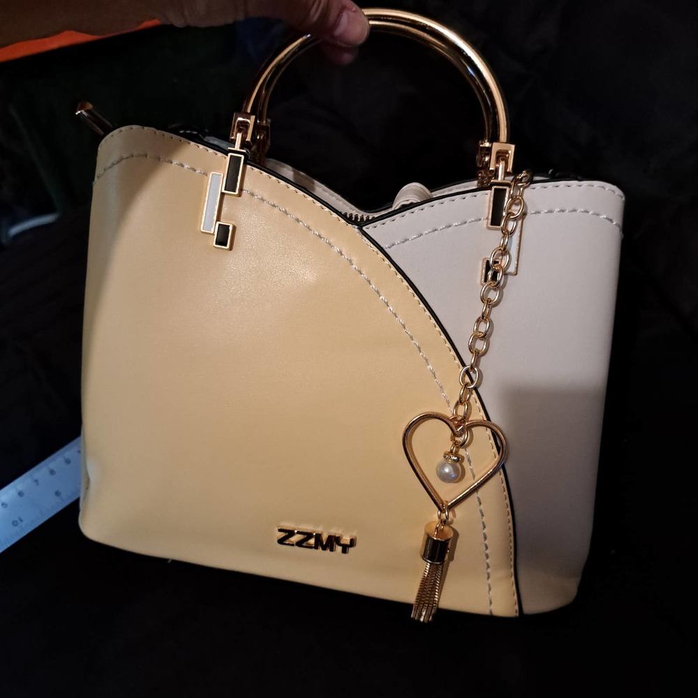 New with tags darling yellow and cream gold metal handles